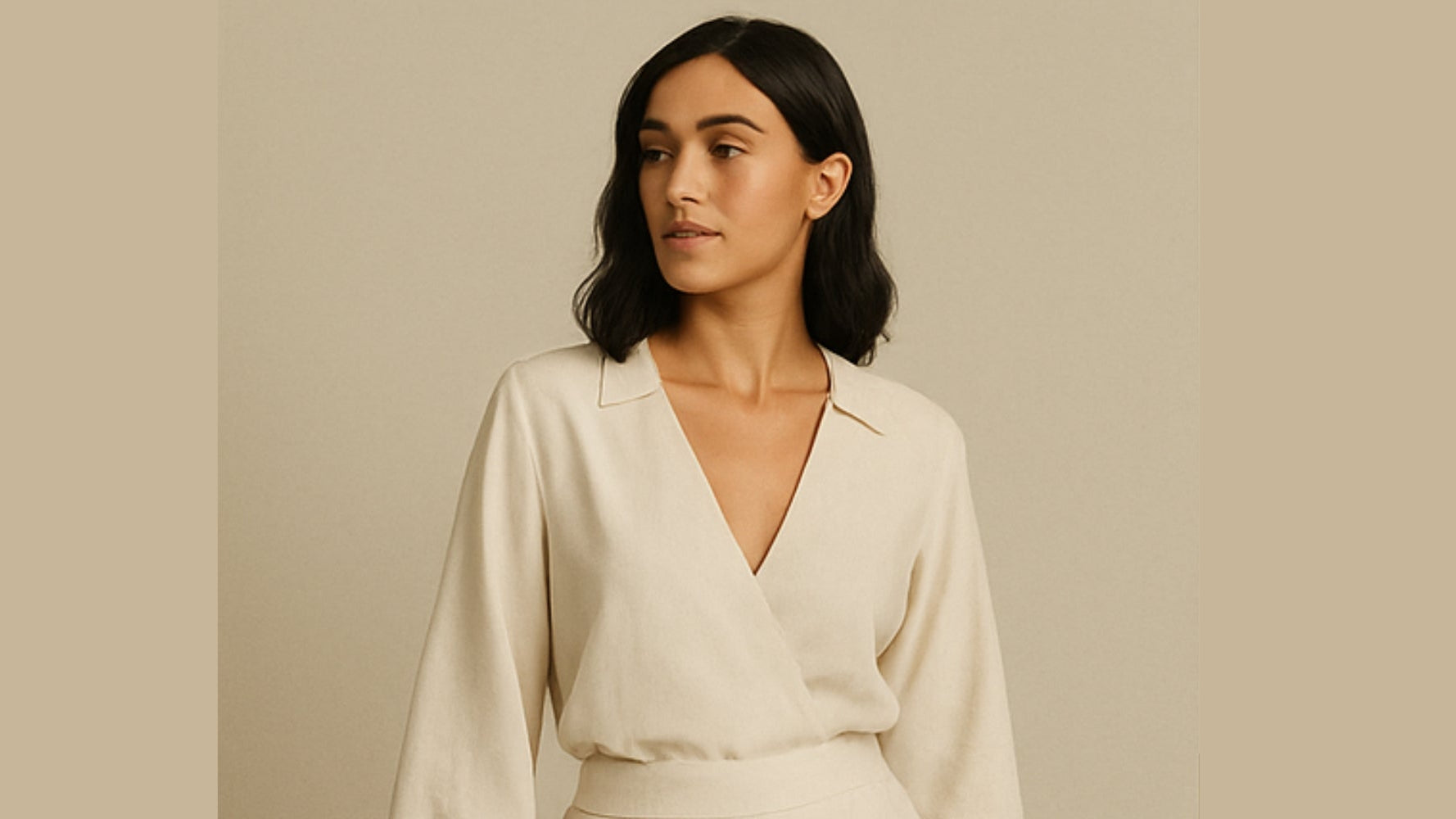 Woman wearing a cream-colored blouse against a beige background